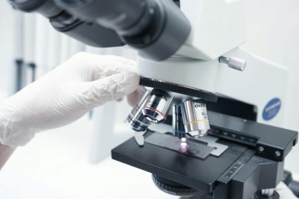 A detailed view of a microscope being used in a modern laboratory.