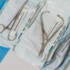 Autoclave Class B Benchtop STB_BZ Series - Harga Terbaik 2024 1 Close-up of sterilized surgical tools in packaging on a clinical table.