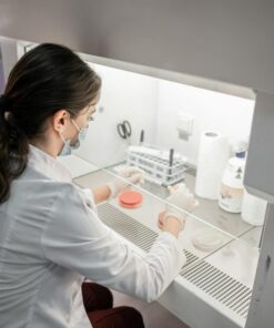A female scientist conducts research in a modern laboratory setting in Baku, Azerbaijan.