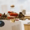 Detailed view of laboratory glass vials held by a clamp with red handles, ideal for science stock images.