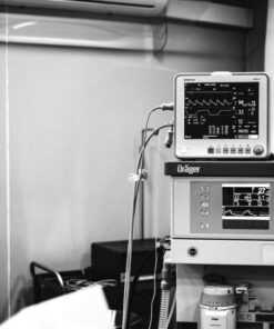 Black and white photo of a Fabius anesthesia workstation in a hospital environment.