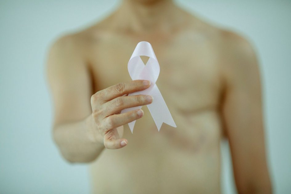 Aktor X Men Tyler Mane Idap Kanker: 7 Fakta Penting Pria Wajib Tahu 1 Crop faceless topless lady with pink ribbon in hand with scar on chest after breast removal surgery from cancer standing in bright studio on white background