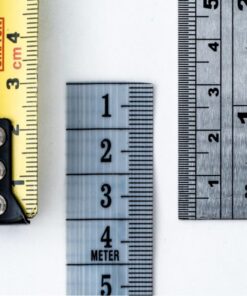 High-resolution image of a tape measure and rulers, showing precise millimeter, centimeter, and inch markings.