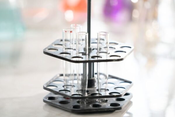 Focused shot of empty test tubes in a lab holder, symbolizing scientific research.