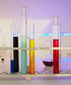Vibrant test tubes filled with liquids in a modern lab setting, showcasing scientific exploration.