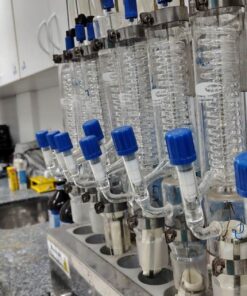 Image of a laboratory setup with glass condensers and lab equipment on the countertop.