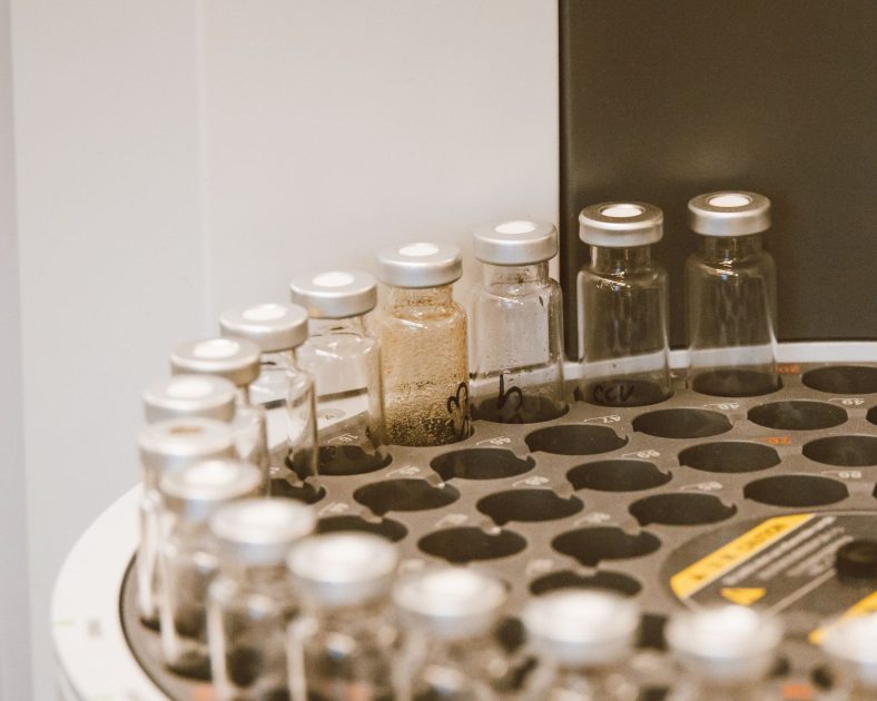 Vials arranged in a lab rack, showcasing scientific organization and research preparation.