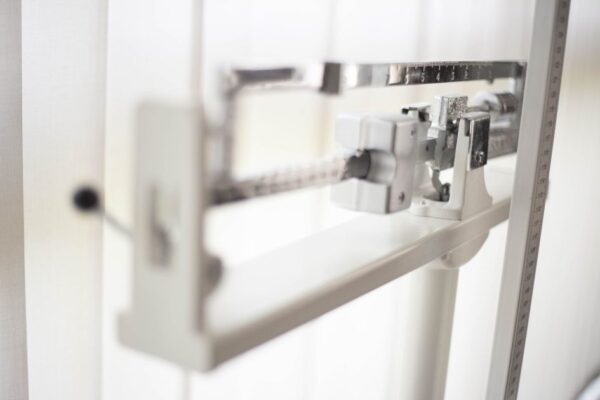 Detailed view of a classic mechanical balance scale, offering precision in weight measurement.
