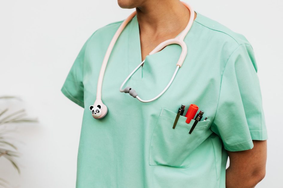 Manajer Kopdes Digaji Pakai APBN: Panduan Lengkap 2024 1 Close-up of a doctor in scrubs with a panda themed stethoscope and pocket pens.