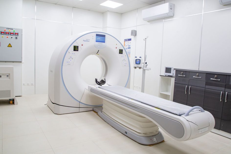 High-resolution image of a modern, clean MRI scanner room in a hospital facility.