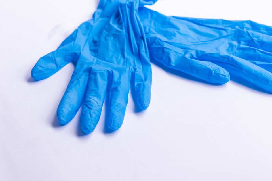 Video Kepala BGN Soal Kasus: 7 Langkah Proteksi Keracunan 2025 1 Pair of blue disposable medical latex gloves for protection placed on white background in light room of hospital