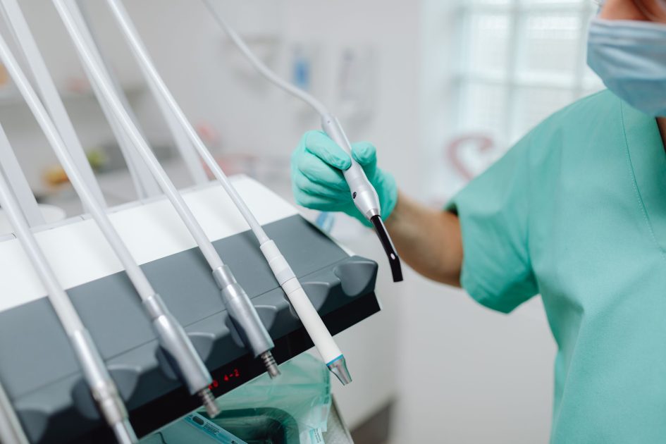 Lebih 90 Peralatan Medis Diimpor: Strategi Efisien 2024 1 Close-up of dental tools and equipment in a modern clinic with a dentist in scrubs.