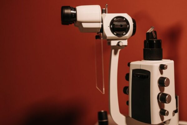High-quality slit lamp microscope used in ophthalmology for eye examinations, captured indoors.