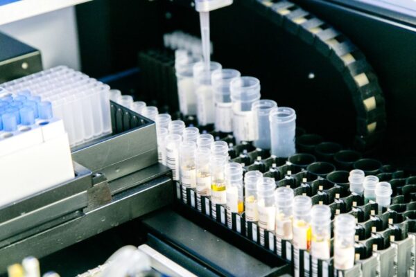 High angle of plastic containers with various samples placed in modern light lab