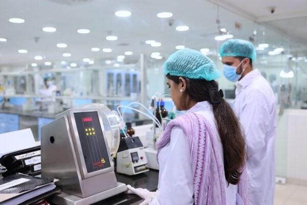 Scientists conducting tests in a pharmaceutical lab in Islamabad, Pakistan.