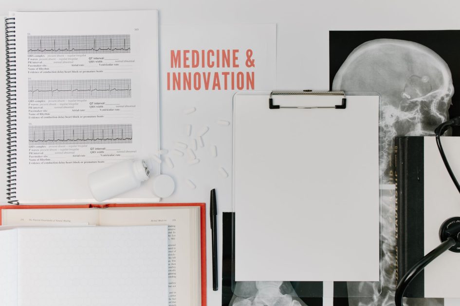 Bedah Pemanfaatan Riset Inovasi Kesehatan: 7 Strategi RI 1 Flat lay of medical documents and equipment emphasizing innovation.