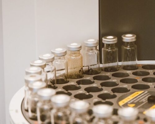 Vials arranged in a lab rack, showcasing scientific organization and research preparation.