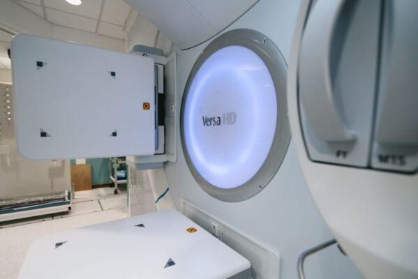 Close-up of Versa HD radiotherapy machine in a clinical setting.
